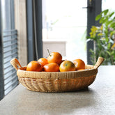 Elegant round bowl storage basket with durable plastic rattan construction, ideal for accessories, kitchen items, or décor.